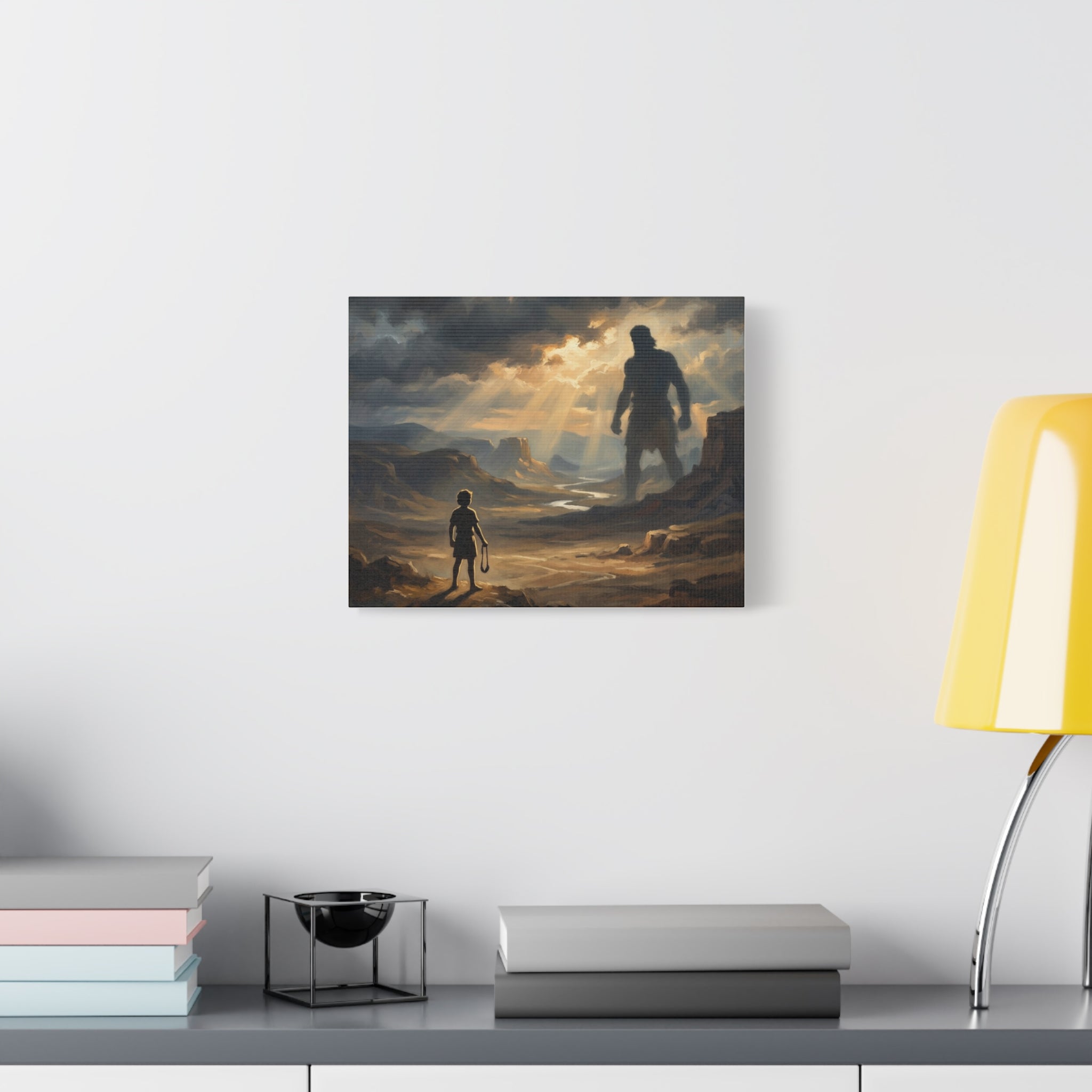 An oil painting style print on a stretched canvas depicting a young boy holding a sling, looking out across a sunlit desert valley toward the giant shadow silhouette of Goliath in the distance. - 4