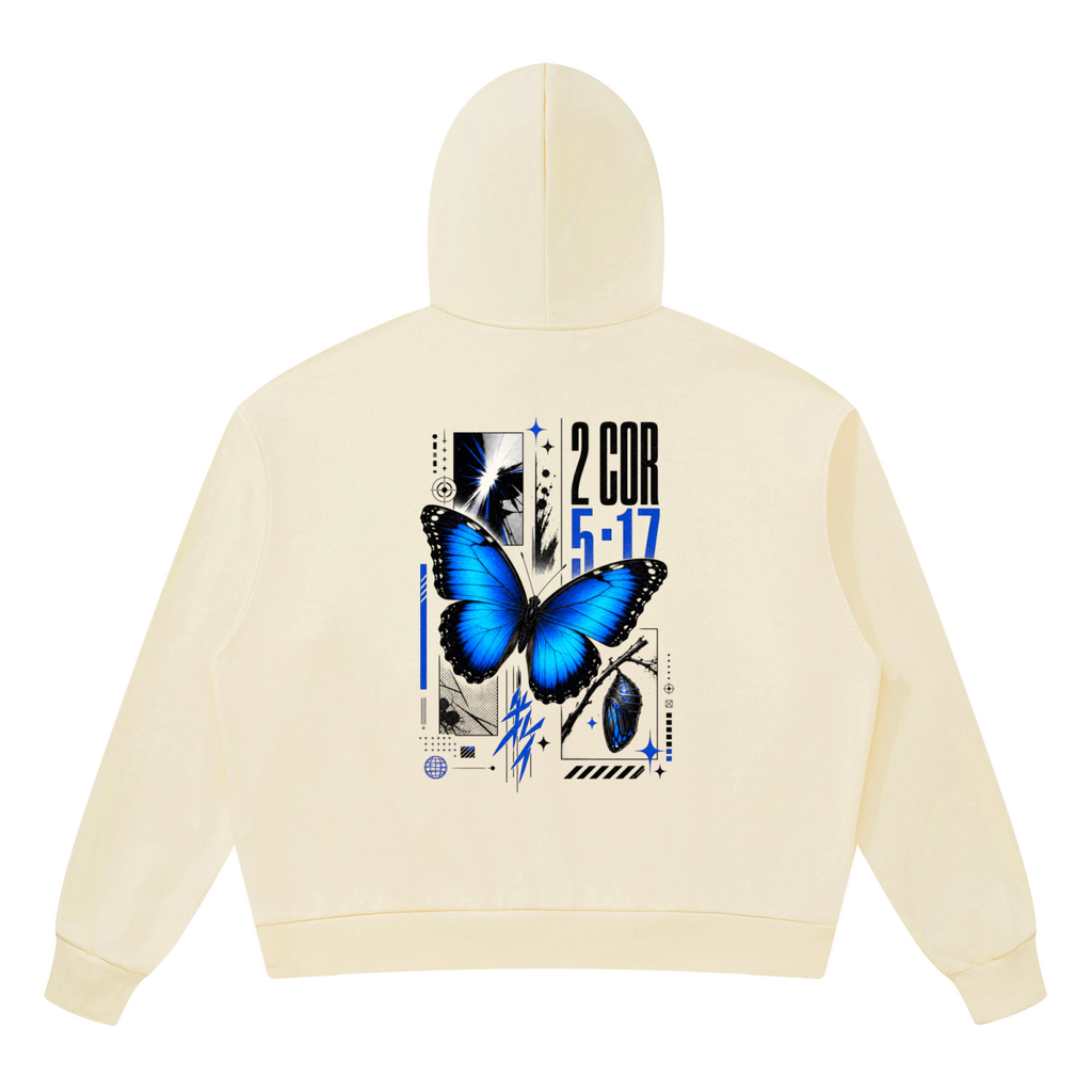 Vibrant electric blue butterfly graphic with bold 2 Corinthians 5 17 scripture typography on the back of a Shomri hoodie.