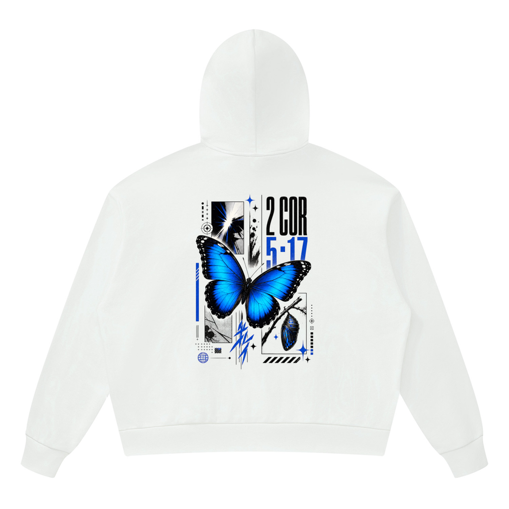 Vibrant electric blue butterfly graphic with bold 2 Corinthians 5 17 scripture typography on the back of a Shomri hoodie.
